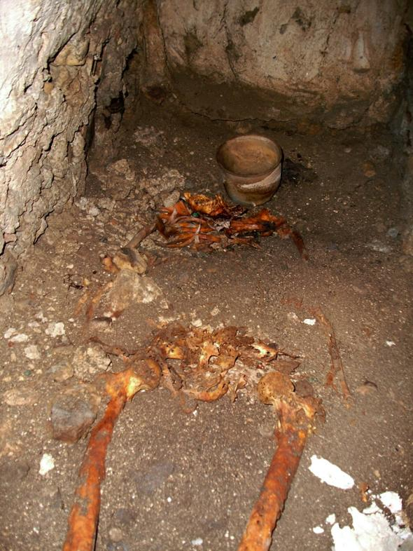 A Skeleton found together with a vase beneath Mayan Site of Bonampak, Temple of Murals in Mexico.