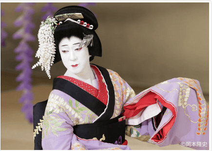 Kabuki actor taking up a female role as a maiden